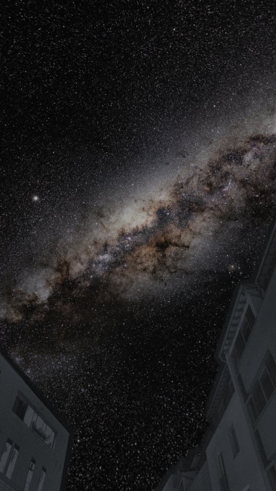 The Milky Way over a dark street