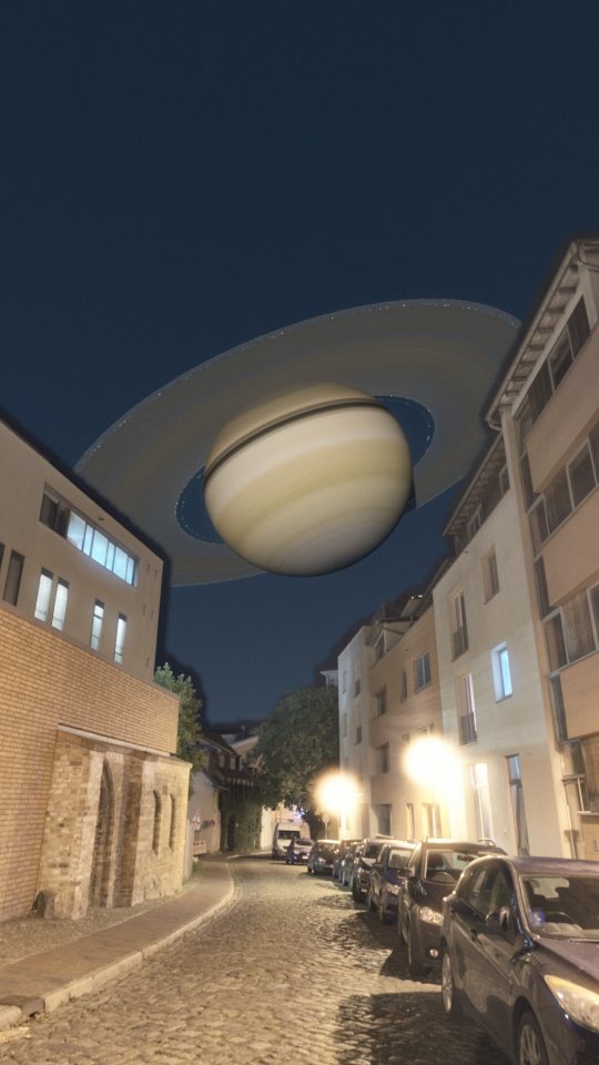 Saturn over a street at night